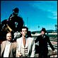 photo Buzz Kulik, Eric Idle, Pierce Brosnan